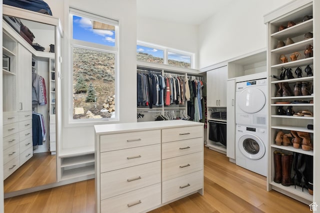 3599 Daybreaker Dr, Park City, UT 84098 - spacious closet featuring stacked washer and dryer and light wood finished floors