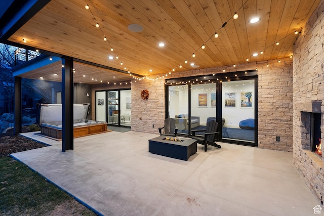 3599 Daybreaker Dr, Park City, UT 84098 - view of patio featuring a hot tub and an outdoor fire pit