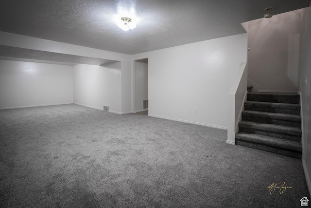 880 E 5700 S, South Ogden, UT 84405 - finished below grade area featuring baseboards, stairway, carpet, and a textured ceiling