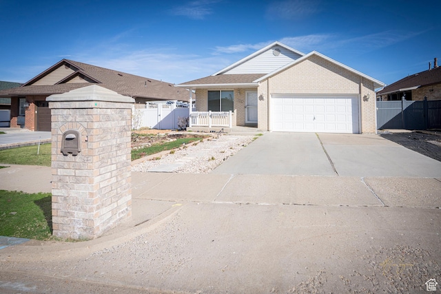 880 E 5700 S, South Ogden, UT 84405 - ranch-style home with driveway, fence, a garage, and a porch