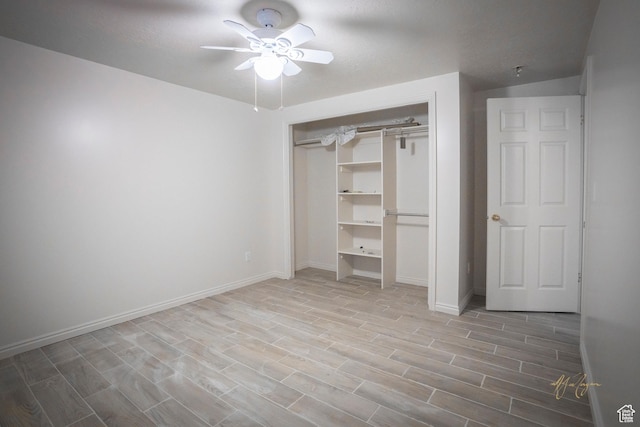 880 E 5700 S, South Ogden, UT 84405 - unfurnished bedroom with wood finished floors, ceiling fan, baseboards, and a closet