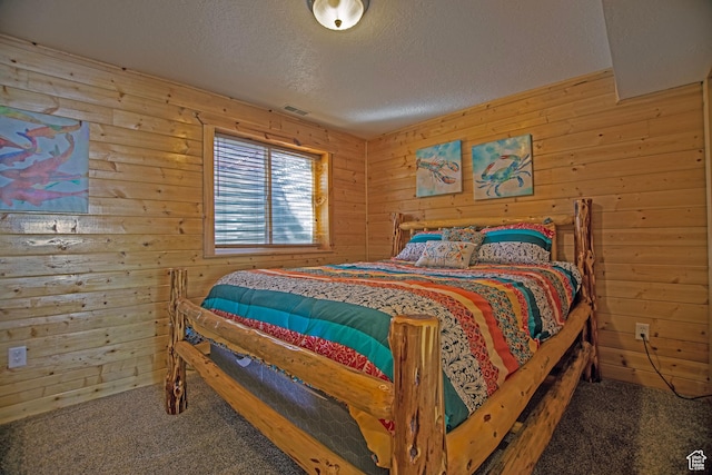 3186 S Sweetwater Pkwy, Garden City, UT 84028 - bedroom featuring carpet, a textured ceiling, and wood walls