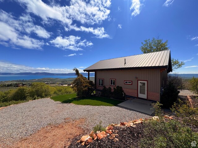 3186 S Sweetwater Pkwy, Garden City, UT 84028 - rear view of property featuring brick siding and a mountain view