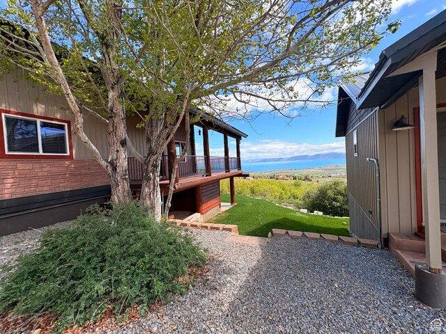 3186 S Sweetwater Pkwy, Garden City, UT 84028 - view of yard with a wooden deck and a patio