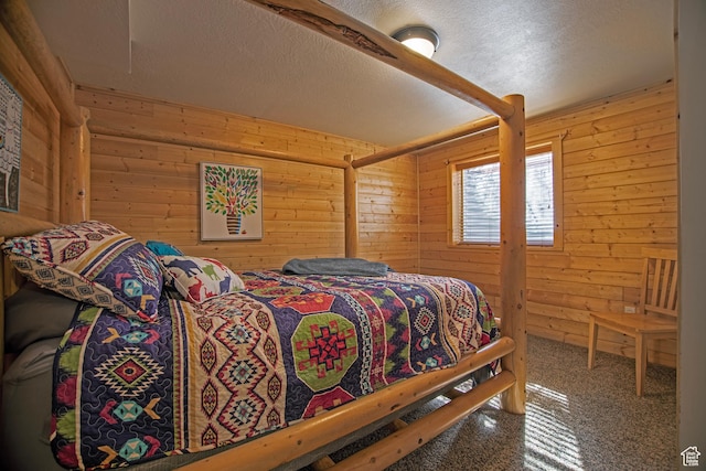 3186 S Sweetwater Pkwy, Garden City, UT 84028 - bedroom featuring wooden walls, carpet floors, and a textured ceiling