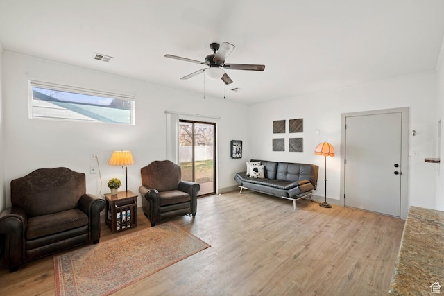 191 N Ash Creek Dr, Toquerville, UT 84774 - living room featuring ceiling fan, visible vents, baseboards, and light wood-style flooring