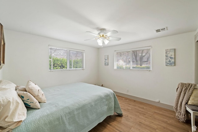 191 N Ash Creek Dr, Toquerville, UT 84774 - bedroom with visible vents, light wood-style floors, and ceiling fan