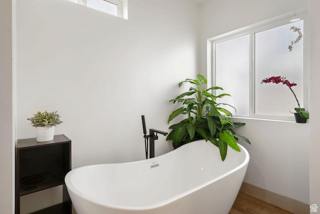 191 N Ash Creek Dr, Toquerville, UT 84774 - bathroom with a freestanding tub, baseboards, and wood finished floors