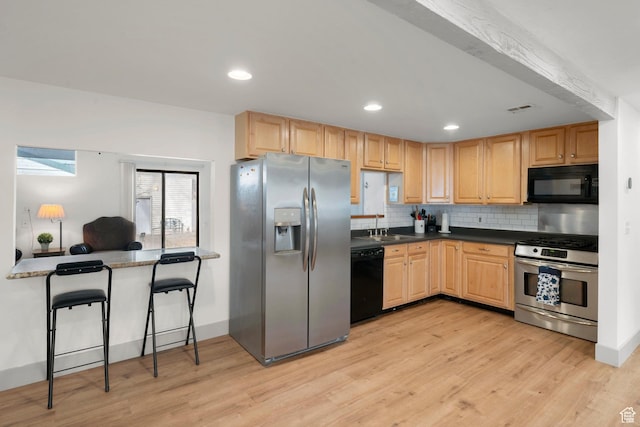 191 N Ash Creek Dr, Toquerville, UT 84774 - kitchen featuring black appliances, light wood-style floors, and light brown cabinetry