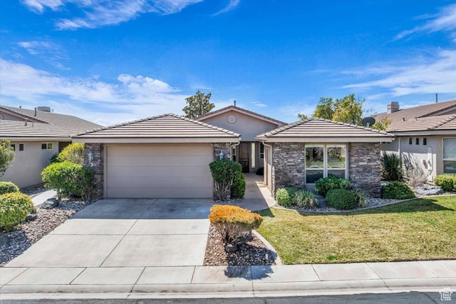 409 N Country Ln Unit 3, St George, UT 84770 - single story home with driveway, a tile roof, stone siding, a front yard, and a garage