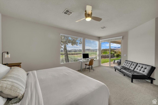 409 N Country Ln Unit 3, St George, UT 84770 - carpeted bedroom featuring ceiling fan, visible vents, a textured ceiling, and access to exterior