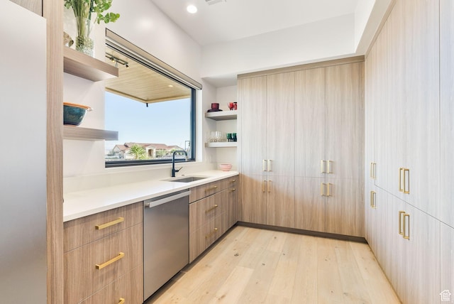 kitchen with light wood finished floors, open shelves, a sink, dishwasher, and modern cabinets