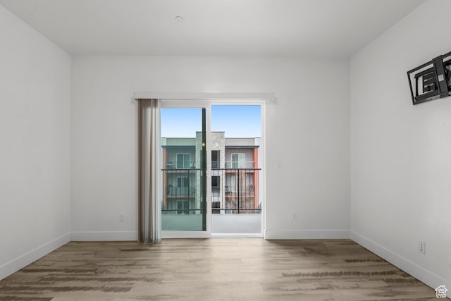 875 S Depot St Unit 344B, Clearfield, UT 84015 - spare room featuring baseboards and wood finished floors