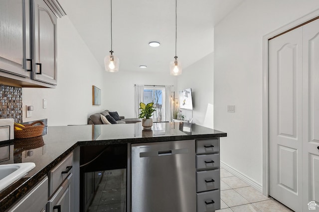 1134 E 3300 S Unit 216, Millcreek, UT 84106 - kitchen with dark stone countertops, light tile patterned floors, gray cabinetry, hanging light fixtures, and dishwasher