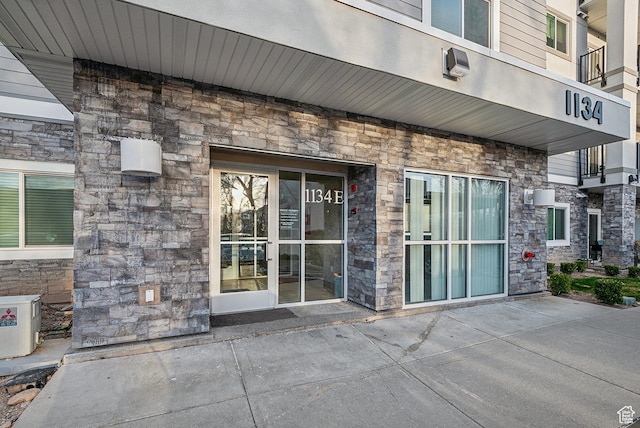 1134 E 3300 S Unit 216, Millcreek, UT 84106 - doorway to property featuring stone siding