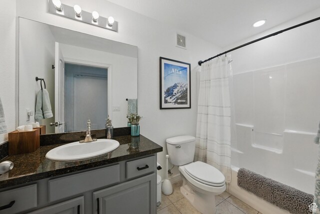 1134 E 3300 S Unit 216, Millcreek, UT 84106 - full bath featuring visible vents, shower / bathtub combination with curtain, toilet, tile patterned flooring, and vanity
