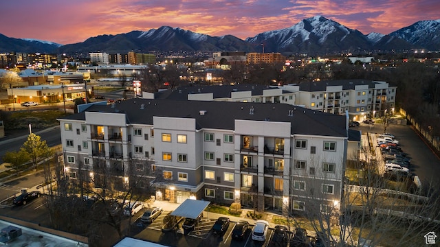 birds eye view of property with a mountain view