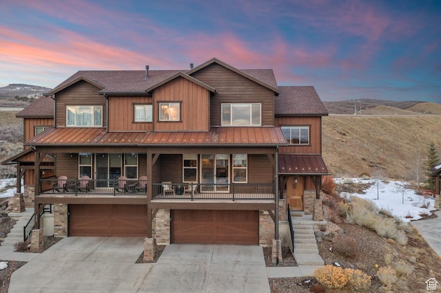 1733 E Viewside Cir, Hideout, UT 84036 - rustic home featuring stone siding, a garage, and concrete driveway