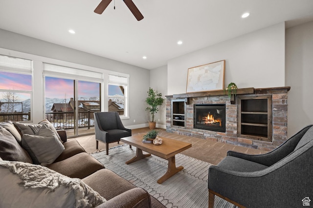 1733 E Viewside Cir, Hideout, UT 84036 - living area featuring recessed lighting, ceiling fan, a stone fireplace, and baseboards