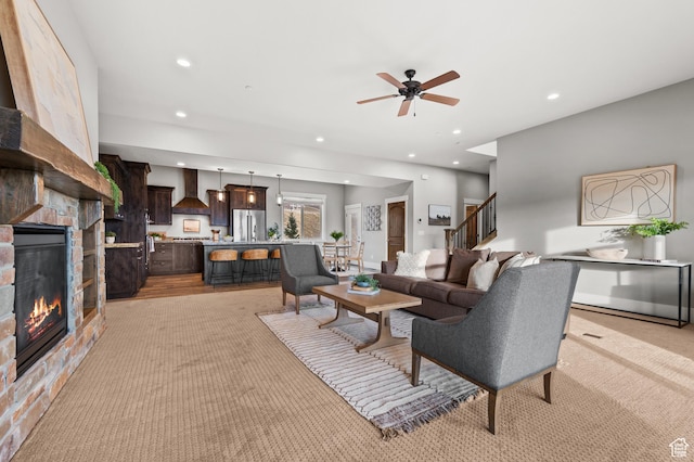 1733 E Viewside Cir, Hideout, UT 84036 - living area with recessed lighting, a fireplace, ceiling fan, stairs, and light carpet
