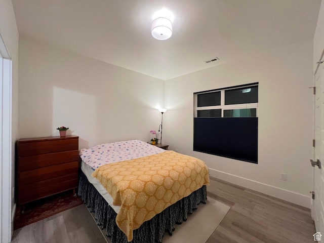 3578 S 805 E Unit 237, Millcreek, UT 84106 - bedroom featuring visible vents, baseboards, and wood finished floors