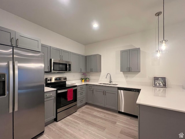 3578 S 805 E Unit 237, Millcreek, UT 84106 - kitchen with stainless steel appliances, gray cabinetry, light countertops, and a sink