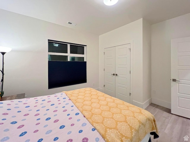 3578 S 805 E Unit 237, Millcreek, UT 84106 - bedroom featuring visible vents, light wood-style flooring, a closet, and baseboards