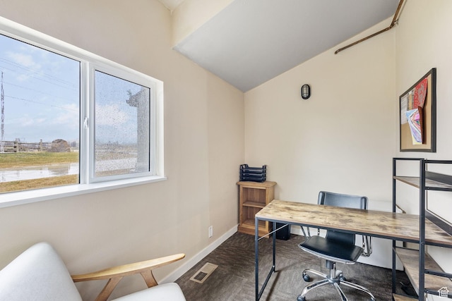 6948 W Dusty Rose Cir, Herriman, UT 84065 - home office featuring lofted ceiling, baseboards, visible vents, and dark carpet
