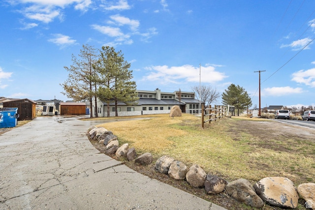 6948 W Dusty Rose Cir, Herriman, UT 84065 - view of front facade featuring a front lawn and driveway