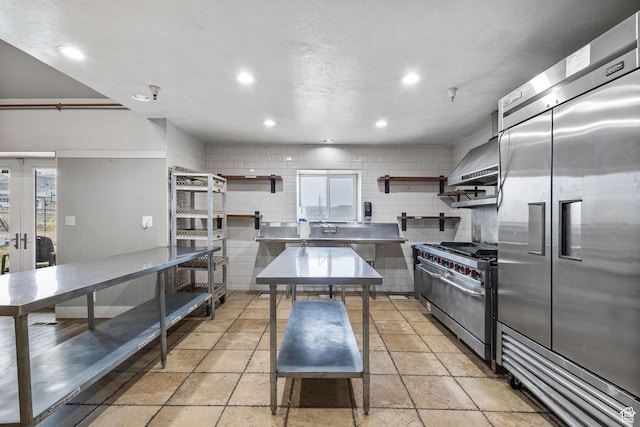 6948 W Dusty Rose Cir, Herriman, UT 84065 - kitchen featuring stainless steel counters, high end appliances, wall chimney range hood, and open shelves