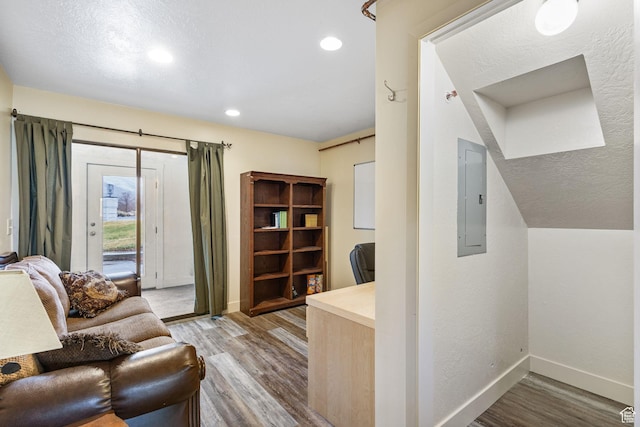 6948 W Dusty Rose Cir, Herriman, UT 84065 - office featuring electric panel, a textured ceiling, wood finished floors, recessed lighting, and baseboards