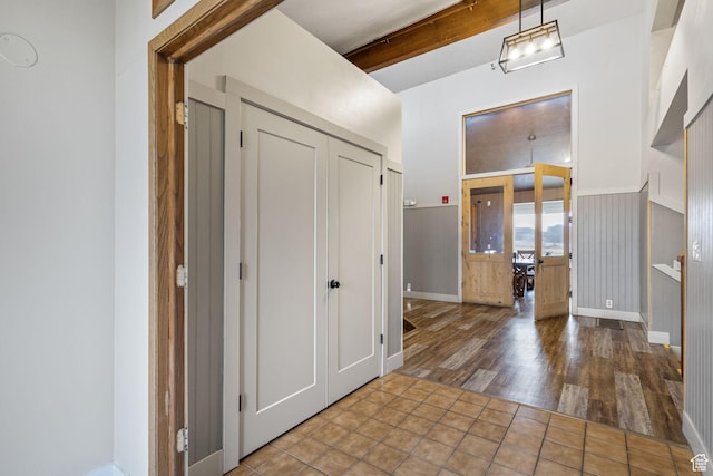 6948 W Dusty Rose Cir, Herriman, UT 84065 - entryway with beamed ceiling, baseboards, and wood finished floors