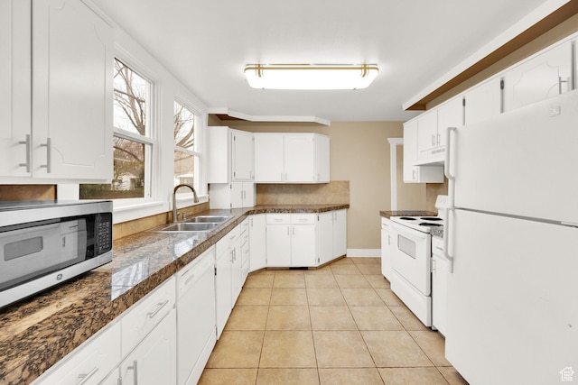 641 E Coatsville Ave S, Salt Lake City, UT 84105 - kitchen featuring white appliances, light tile patterned floors, a sink, tile counters, and under cabinet range hood