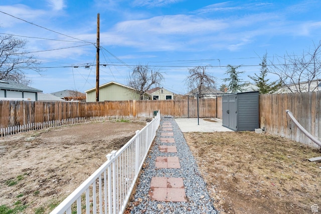 641 E Coatsville Ave S, Salt Lake City, UT 84105 - view of yard featuring a fenced backyard, a shed, and an outdoor structure