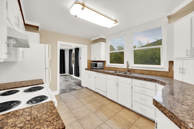 641 E Coatsville Ave S, Salt Lake City, UT 84105 - kitchen with a sink, tile counters, white cabinets, dishwasher, and stainless steel microwave