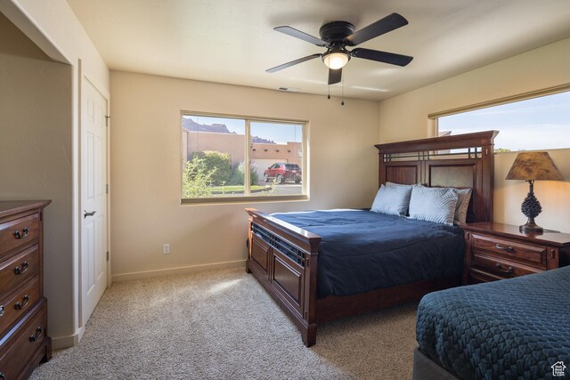 3686 S Spanish Valley Dr Unit U-3, Moab, UT 84532 - bedroom featuring multiple windows, visible vents, baseboards, and light carpet