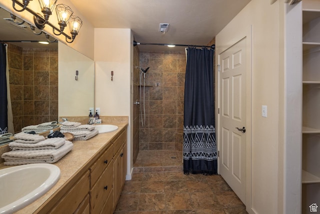 3686 S Spanish Valley Dr Unit U-3, Moab, UT 84532 - full bath featuring double vanity, a chandelier, tiled shower, and a sink