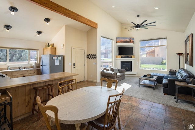 3686 S Spanish Valley Dr Unit U-3, Moab, UT 84532 - dining area with ceiling fan, dark carpet, vaulted ceiling, recessed lighting, and a glass covered fireplace