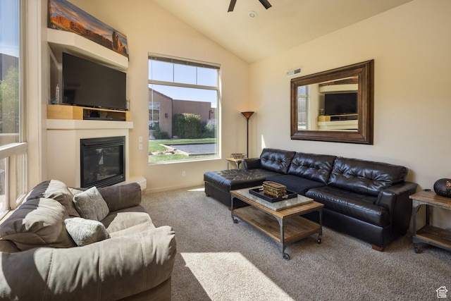 3686 S Spanish Valley Dr Unit U-3, Moab, UT 84532 - carpeted living area featuring a glass covered fireplace, baseboards, a ceiling fan, and vaulted ceiling