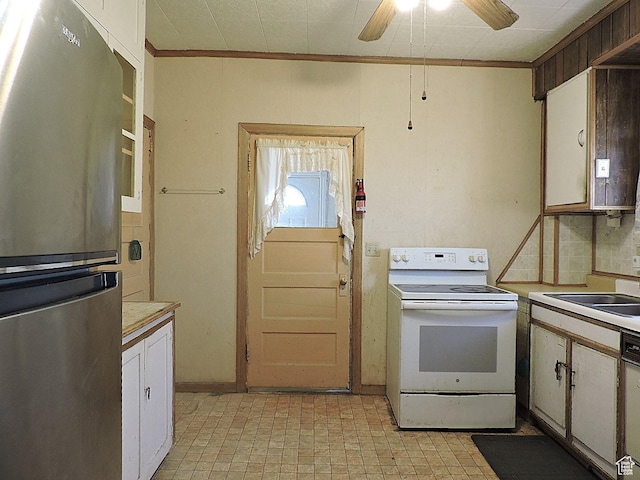 kitchen featuring light countertops, white electric range oven, a sink, ceiling fan, and freestanding refrigerator