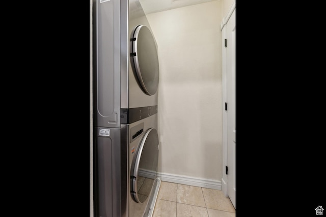 7035 N 2200 W Unit 3W, Park City, UT 84098 - washroom featuring light tile patterned floors, laundry area, baseboards, and stacked washer and dryer