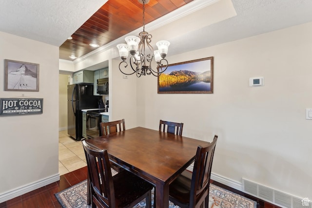 7035 N 2200 W Unit 3W, Park City, UT 84098 - dining space with wood finished floors, baseboards, visible vents, wood ceiling, and a chandelier