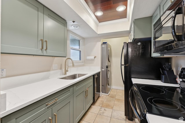 7035 N 2200 W Unit 3W, Park City, UT 84098 - kitchen featuring stacked washing maching and dryer, a tray ceiling, a sink, black appliances, and crown molding