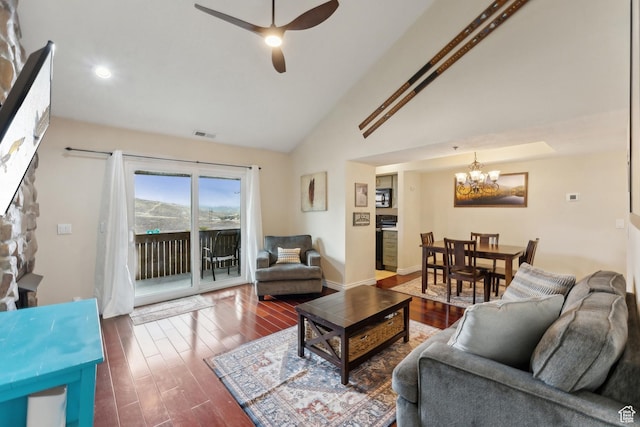 7035 N 2200 W Unit 3W, Park City, UT 84098 - living room with visible vents, ceiling fan with notable chandelier, wood finished floors, baseboards, and lofted ceiling