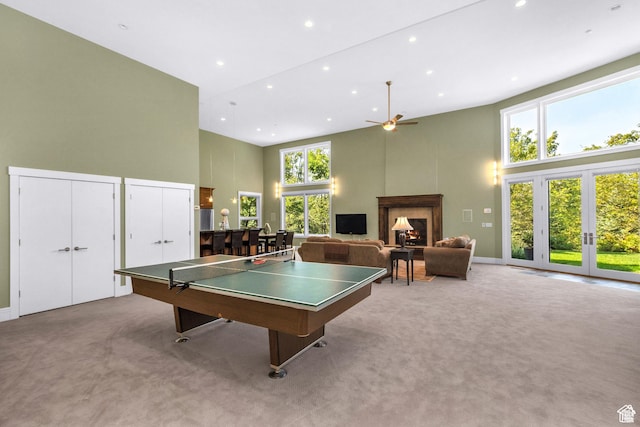 4127 E Mathews Way S, Salt Lake City, UT 84124 - playroom with a ceiling fan, a high ceiling, a warm lit fireplace, and carpet