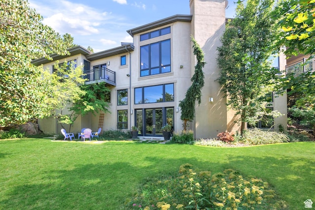 4127 E Mathews Way S, Salt Lake City, UT 84124 - back of property with stucco siding, a lawn, a chimney, and a balcony