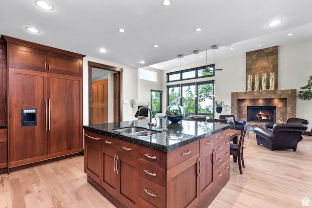 4127 E Mathews Way S, Salt Lake City, UT 84124 - kitchen featuring recessed lighting, a large fireplace, a sink, and light wood-style flooring