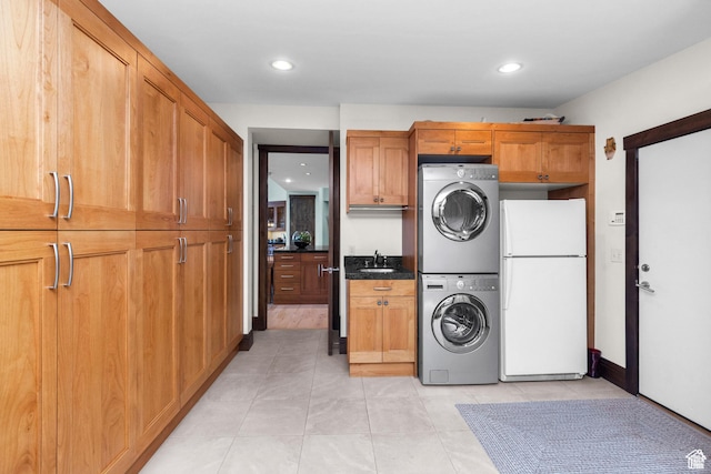 4127 E Mathews Way S, Salt Lake City, UT 84124 - laundry area with a sink, light tile patterned flooring, recessed lighting, cabinet space, and stacked washing maching and dryer