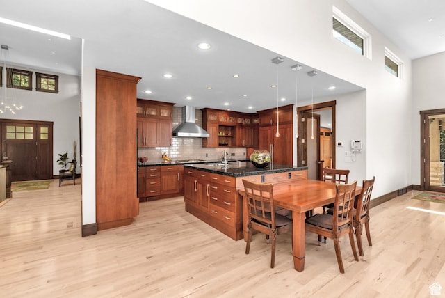 4127 E Mathews Way S, Salt Lake City, UT 84124 - dining area with baseboards, light wood-style flooring, a towering ceiling, and recessed lighting