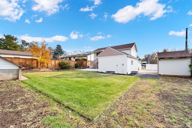 2745 E 3100 S, Millcreek, UT 84109 - view of yard featuring a patio, an outdoor structure, a fenced backyard, and a shed